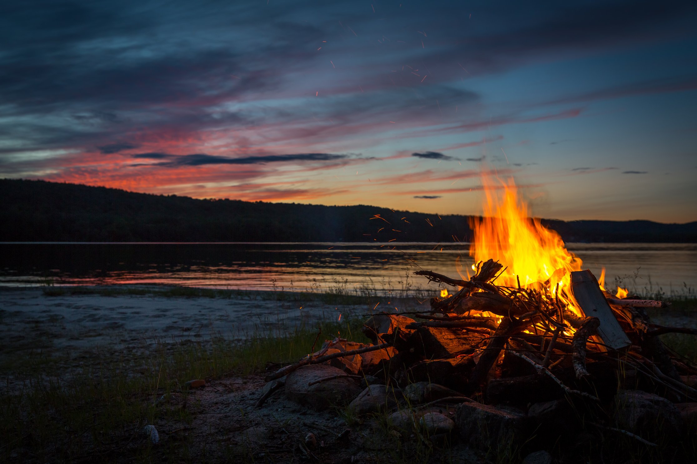 Summer Campfire and Lake at sunset